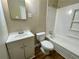 Clean bathroom featuring a white vanity, toilet, and a tub with a shower at 371 Landers Sw Dr, Mableton, GA 30126