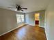 This bedroom shows hardwood floors, two windows, and a connecting bathroom at 371 Landers Sw Dr, Mableton, GA 30126