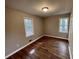 Bedroom with hardwood floors, two windows, and neutral walls at 371 Landers Sw Dr, Mableton, GA 30126