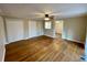 Open living space featuring hardwood floors, neutral paint, white trim and doors with backyard access at 371 Landers Sw Dr, Mableton, GA 30126