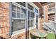 View of balcony showing brickwork and a table with mosaic tabletop on artificial turf at 1258 Dekalb Ne Ave # 129, Atlanta, GA 30307