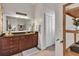 Bathroom with a dark vanity, large mirror, and ample storage space at 1258 Dekalb Ne Ave # 129, Atlanta, GA 30307