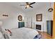 Bright bedroom offers hardwood floors, fresh paint, and decorative fireplace at 1258 Dekalb Ne Ave # 129, Atlanta, GA 30307