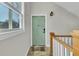 Charming entryway featuring a mint green door, decorative door knocker and a bike-themed welcome mat at 1258 Dekalb Ne Ave # 129, Atlanta, GA 30307
