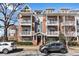 Brick townhome with multiple balconies, showcasing classic architecture and street view at 1258 Dekalb Ne Ave # 129, Atlanta, GA 30307