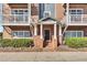 Charming brick townhouse features a welcoming entrance with white columns and private balconies at 1258 Dekalb Ne Ave # 129, Atlanta, GA 30307