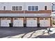 Attached garages with white doors, offering convenient parking and storage at 1258 Dekalb Ne Ave # 129, Atlanta, GA 30307