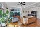 Open-concept living room with a large monstera, providing a comfortable and stylish space for relaxation at 1258 Dekalb Ne Ave # 129, Atlanta, GA 30307