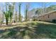 A spacious backyard with mature trees offers plenty of room to roam at 37 Indian Hills Ct, Dallas, GA 30157