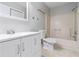 A well-lit bathroom featuring a vanity, toilet, and shower-tub combination at 37 Indian Hills Ct, Dallas, GA 30157