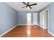 Spacious bedroom with hardwood floors, a ceiling fan, and access to a bathroom at 37 Indian Hills Ct, Dallas, GA 30157