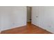 An empty bedroom featuring hardwood floors, a window, and a neutral color palette at 37 Indian Hills Ct, Dallas, GA 30157
