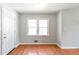 Bright empty room with hardwood floors and a double window at 37 Indian Hills Ct, Dallas, GA 30157