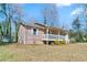 View of home's exterior and shed showing the lawn and surroundings at 37 Indian Hills Ct, Dallas, GA 30157