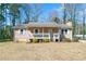Charming single-story home with a cozy front porch and a well-maintained lawn at 37 Indian Hills Ct, Dallas, GA 30157