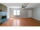 Cozy living room showcasing hardwood floors and a stone fireplace at 37 Indian Hills Ct, Dallas, GA 30157