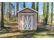 Storage shed in the backyard for storing tools and outdoor equipment at 37 Indian Hills Ct, Dallas, GA 30157