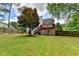 Spacious backyard with a deck perfect for outdoor entertaining and a fenced perimeter for privacy at 4184 Wyndham Park Way, Buford, GA 30519