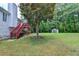 This spacious backyard has a tree, a shed, and a view to the back deck at 4184 Wyndham Park Way, Buford, GA 30519