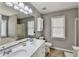 Bathroom featuring a double vanity, soaking tub and a separate shower at 4184 Wyndham Park Way, Buford, GA 30519