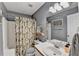 Charming bathroom with cactus-themed shower curtain, white vanity, and coordinated decor at 4184 Wyndham Park Way, Buford, GA 30519