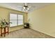 Bedroom features neutral walls, carpeting, a ceiling fan and a window at 4184 Wyndham Park Way, Buford, GA 30519