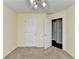 Bedroom with a ceiling fan, carpeting and a doorway to another room at 4184 Wyndham Park Way, Buford, GA 30519
