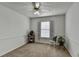Bedroom features neutral walls, carpeting, a ceiling fan and a window at 4184 Wyndham Park Way, Buford, GA 30519