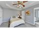 This bedroom has carpeted floors, a closet, and a view to an ensuite bathroom at 4184 Wyndham Park Way, Buford, GA 30519