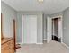 Bedroom featuring neutral carpet, closet space, and doorway leading to another room at 4184 Wyndham Park Way, Buford, GA 30519