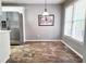 This kitchen has stainless steel appliances and a dining area with a large window at 4184 Wyndham Park Way, Buford, GA 30519