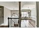 Elegant dining room featuring wainscoting, hardwood floors, and natural light at 4184 Wyndham Park Way, Buford, GA 30519