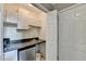 Features a compact kitchenette setup with white cabinets, mini-fridge, and sink at 4184 Wyndham Park Way, Buford, GA 30519