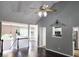 Inviting living room with a vaulted ceiling, hardwood floors, and decorative ceiling fan at 4184 Wyndham Park Way, Buford, GA 30519