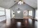 Open-concept living room with hardwood floors and seamless transition to other living spaces at 4184 Wyndham Park Way, Buford, GA 30519