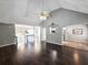 Spacious living room with hardwood floors, vaulted ceiling, and seamless flow to other areas at 4184 Wyndham Park Way, Buford, GA 30519