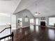 Living room boasts hardwood floors, fireplace, open layout, and a seamless flow throughout at 4184 Wyndham Park Way, Buford, GA 30519