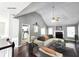 Bright living room features vaulted ceilings, hardwood floors, fireplace, and open layout at 4184 Wyndham Park Way, Buford, GA 30519