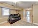 Finished basement recreation room with ample space, updated flooring, and built-in features at 4184 Wyndham Park Way, Buford, GA 30519