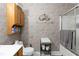 Bathroom featuring vanity storage and shower with glass enclosure at 1220 Tab Roberts Rd, Lawrenceville, GA 30043