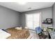 Cozy bedroom offers natural light and a peaceful ambiance for a relaxing retreat at 1220 Tab Roberts Rd, Lawrenceville, GA 30043
