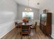 Traditional dining room boasts natural light and modern floors, perfect for Gathering meals and entertaining guests at 1220 Tab Roberts Rd, Lawrenceville, GA 30043