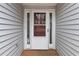 Close-up view of the home's front door, complete with sidelights and an elegant design at 1220 Tab Roberts Rd, Lawrenceville, GA 30043