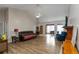 Bright living room featuring beautiful hardwood floors, ceiling fan, and large windows at 1220 Tab Roberts Rd, Lawrenceville, GA 30043