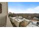 Aerial view of the apartments shows city in the distance and mature trees at 145 15Th Ne St # 843, Atlanta, GA 30309