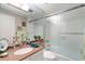Bathroom with pink granite vanity and a shower/tub with glass doors at 145 15Th Ne St # 843, Atlanta, GA 30309