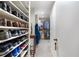 Spacious walk-in closet with extensive shoe shelves and clothing racks at 145 15Th Ne St # 843, Atlanta, GA 30309
