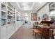 Bright hallway showcases recessed lights, carpet, custom shelves, and view into living space at 145 15Th Ne St # 843, Atlanta, GA 30309