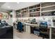 Spacious home office features built-in shelves, a desk, and great lighting at 145 15Th Ne St # 843, Atlanta, GA 30309