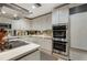 Well-appointed kitchen featuring stainless steel appliances, sleek countertops, and modern white cabinets at 145 15Th Ne St # 843, Atlanta, GA 30309
